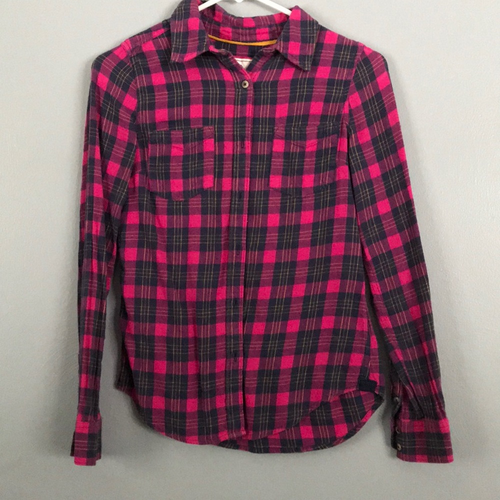 Pink and navy flannel shirt.